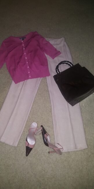 A pink shirt and white pants with shoes