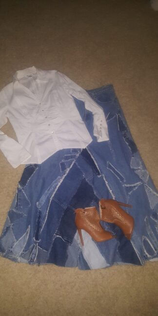 A pair of shoes and a shirt on the floor.