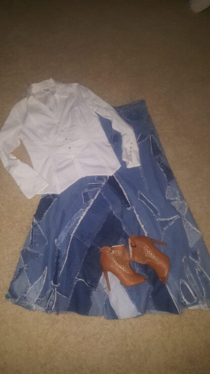 A pair of shoes and a shirt on the floor.