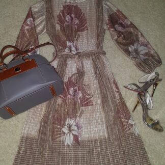 A dress and purse are on the floor.