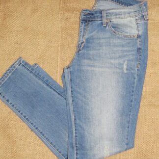 A pair of jeans that are on the ground.