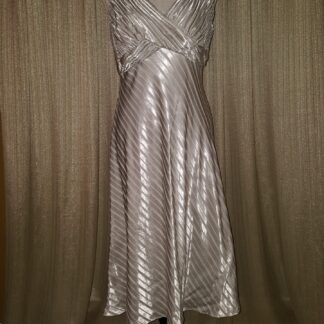 A dress that is on display against the wall.