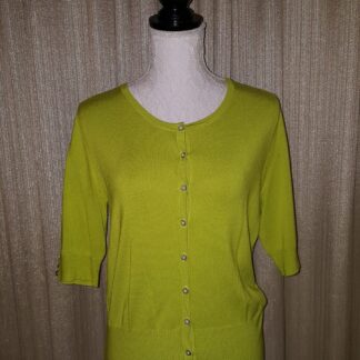 A lime green cardigan is shown on display.