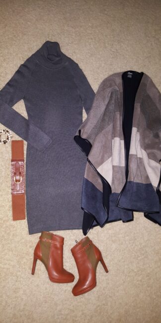 A couple of outfits laid out on the floor.