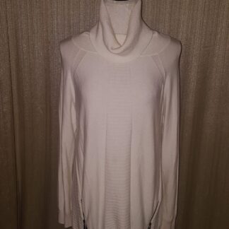 A white sweater with long sleeves and a cowl neck.